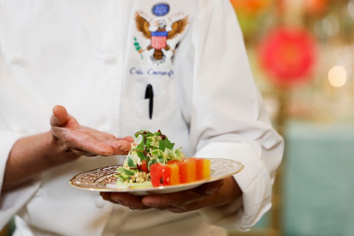 White House Executive Chef Cristeta Comerford and Guest Chef Nina Curtis pose as they present dishes from the menu during a media preview in advance of Thursdays State Dinner as part of Indian Prime Minister Narendra Modis official visit to the United States, in the State Dining Room of the White House in Washington, U.S., June 21, 2023. REUTERS/Evelyn Hockstein