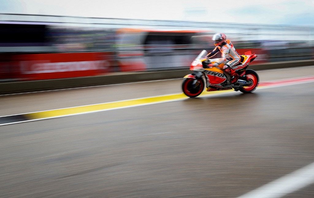Repsol Honda Team's Spanish rider Marc Marquez leaves the pits for the qualifying session for the MotoGP German motorcycle Grand Prix at the Sachsenring racing circuit in Hohenstein-Ernstthal near Chemnitz, eastern Germany, on June 17, 2023. (Photo by Ronny Hartmann / AFP)