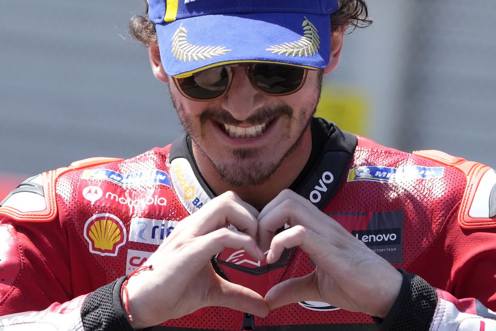 Italian rider Francesco Bagnaia celebrates after winning the MotoGP race at the Dutch Grand Prix in Assen, northern Netherlands, Sunday, June 25, 2023. (AP Photo/Peter Dejong)