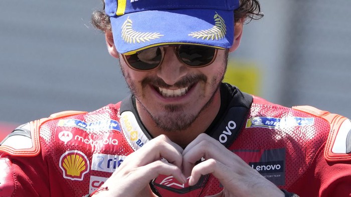 Italian rider Francesco Bagnaia celebrates after winning the MotoGP race at the Dutch Grand Prix in Assen, northern Netherlands, Sunday, June 25, 2023. (AP Photo/Peter Dejong)
