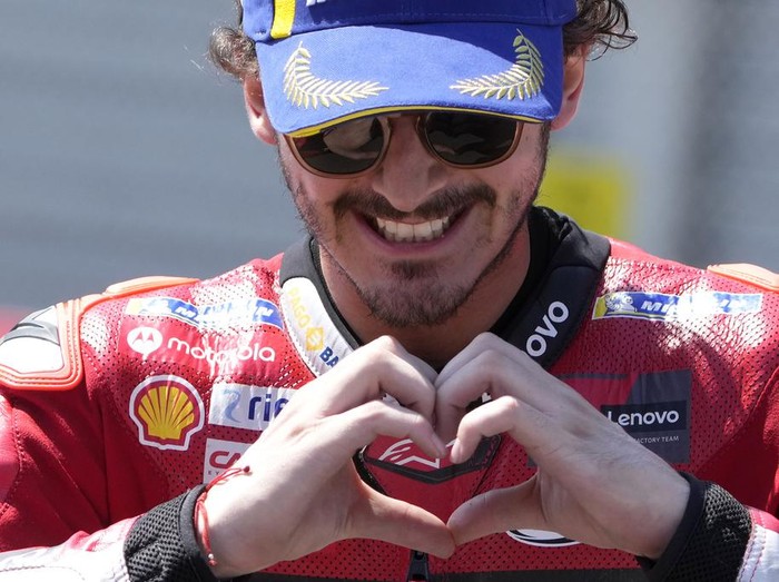 Italian rider Francesco Bagnaia celebrates after winning the MotoGP race at the Dutch Grand Prix in Assen, northern Netherlands, Sunday, June 25, 2023. (AP Photo/Peter Dejong)