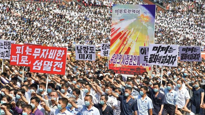 People attend a mass rally denouncing the U.S. in Pyongyang, North Korea, June 25, 2023 in this photo released by North Koreas Korean Central News Agency (KCNA). KCNA via REUTERS