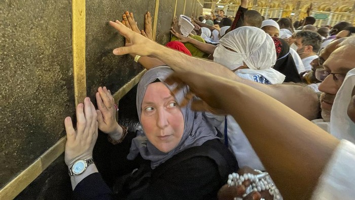 Muslim pilgrims pray in front of the Kaaba, the cubic building at the Grand Mosque, during the annual hajj pilgrimage, in Mecca, Saudi Arabia, Sunday, June 25, 2023. Muslim pilgrims are converging on Saudi Arabia's holy city of Mecca for the largest hajj since the coronavirus pandemic severely curtailed access to one of Islam's five pillars. (AP Photo/Amr Nabil)