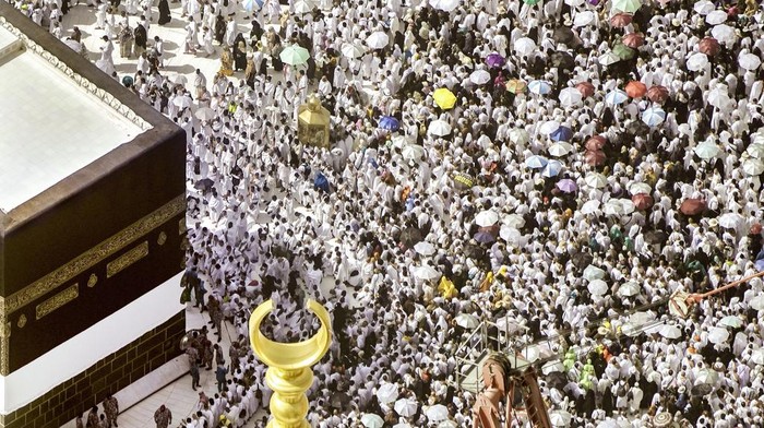 Thousands of Muslim pilgrims hold umbrellas as they circumambulate around the Kaaba, the cubic building at the Grand Mosque, during the annual hajj pilgrimage, in Mecca, Saudi Arabia, Sunday, June 25, 2023. Muslim pilgrims are converging on Saudi Arabias holy city of Mecca for the largest Hajj since the coronavirus pandemic severely curtailed access to one of Islams five pillars. (AP Photo/Amr Nabil)