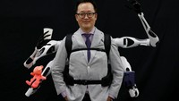 Masahiko Inami of the University of Tokyo poses with the wearable Jizai Arms robot arms at his lab during its demonstration in Tokyo, Japan, June 22, 2023. REUTERS/Kim Kyung-Hoon