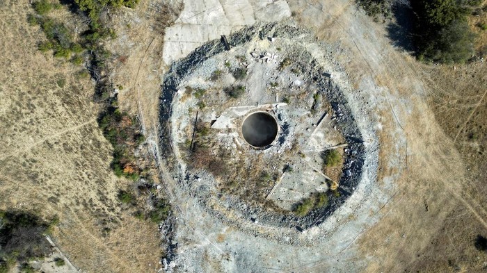 View of an abandoned mine shaft where 31 illegal miners are thought to have died due to a suspected methane gas leak, at Virginia mine, near Welkom, South Africa, June 26, 2023. REUTERS/Shafiek Tassiem REFILE - CORRECTING INFORMATION