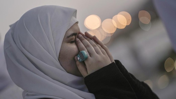 An Egyptian pilgrim prays on the rocky hill known as the Mountain of Mercy, on the Plain of Arafat, during the annual Hajj pilgrimage, near the holy city of Mecca, Saudi Arabia, Tuesday, June 27, 2023. Around two million pilgrims are converging on Saudi Arabia's holy city of Mecca for the largest Hajj since the coronavirus pandemic severely curtailed access to one of Islam's five pillars. (AP Photo/Amr Nabil)