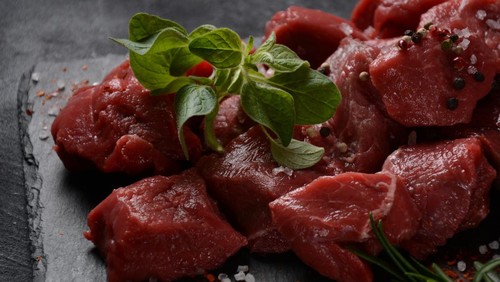 Diced raw beef with ingredients, herbs and spices