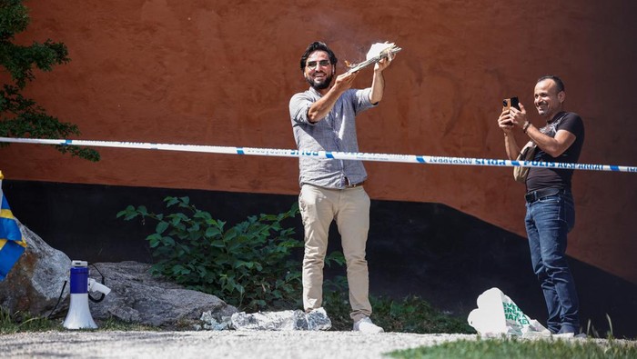 A demonstrator burns the Koran outside Stockholms central mosque in Stockholm, Sweden June 28, 2023. TT News Agency/Stefan Jerrevang/via REUTERS      ATTENTION EDITORS - THIS IMAGE WAS PROVIDED BY A THIRD PARTY. SWEDEN OUT. NO COMMERCIAL OR EDITORIAL SALES IN SWEDEN.