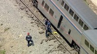 Empat belas orang di kereta dibawa ke rumah sakit dengan luka ringan, sementara pengemudi truk dibawa ke pusat trauma dengan cedera kepala, kata McGrath. 