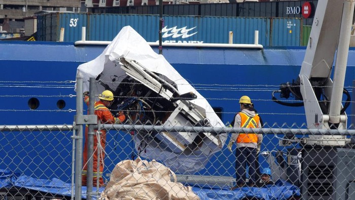 Debris from the Titan submersible, recovered from the ocean floor near the wreck of the Titanic, is unloaded from the ship Horizon Arctic at the Canadian Coast Guard pier in St. Johns, Newfoundland, Wednesday, June 28, 2023. (Paul Daly/The Canadian Press via AP)