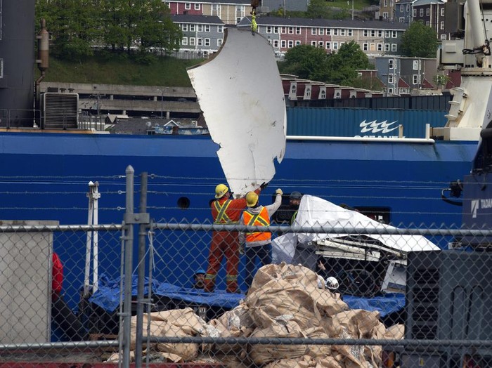 Debris from the Titan submersible, recovered from the ocean floor near the wreck of the Titanic, is unloaded from the ship Horizon Arctic at the Canadian Coast Guard pier in St. Johns, Newfoundland, Wednesday, June 28, 2023. (Paul Daly/The Canadian Press via AP)