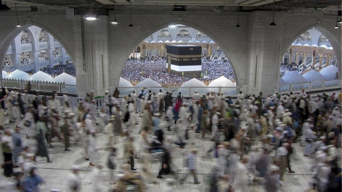 Muslim pilgrims circumambulate around the Kaaba, the cubic structure at the Grand Mosque, during the annual hajj pilgrimage, in Mecca, Saudi Arabia, Saturday, June 24, 2023. Muslim pilgrims are converging on Saudi Arabia's holy city of Mecca for the largest hajj since the coronavirus pandemic severely curtailed access to one of Islam's five pillars. (AP Photo/Amr Nabil)