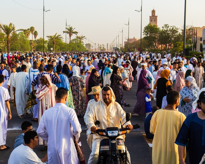 Marrakech, Morocco - 10 July 2022 : People hanging around after the prayer of Aid Al Adha 2022 in Marrakech, Morocco