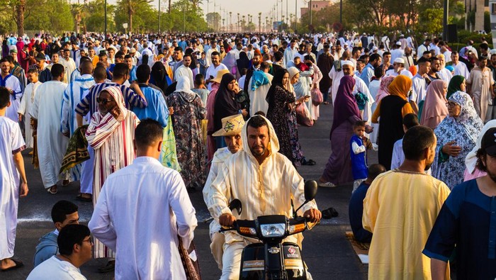 Marrakech, Morocco - 10 July 2022 : People hanging around after the prayer of Aid Al Adha 2022 in Marrakech, Morocco