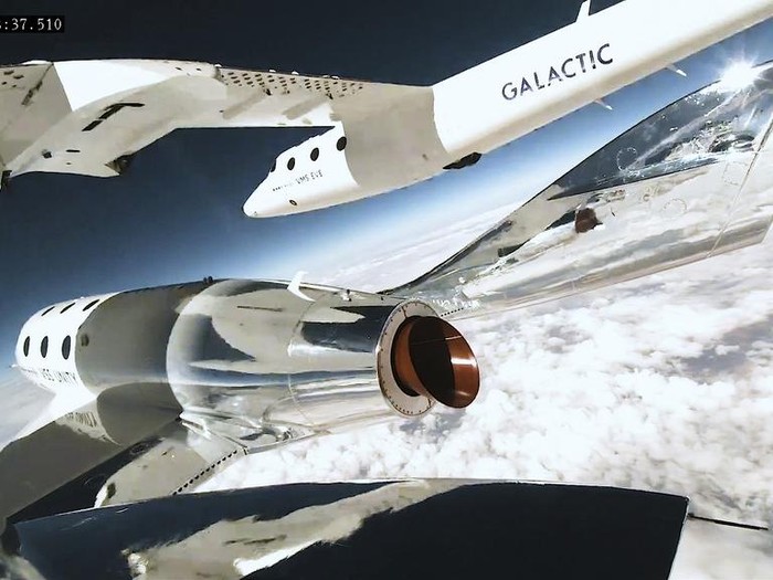 This Thursday, June 29, 2023, image provided by Virgin Galactic show the rocket of the companys spaceplane igniting during a research flight that included Italian specialists who conducted a number of microgravity experiments. With the research flight complete, Virgin Galactic plans to begin commercial flights with paying ticket holders in August. (Virgin Galactic via AP)