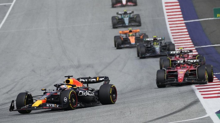 Red Bull driver Max Verstappen of the Netherlands, left, leads Ferrari driver Charles Leclerc of Monaco, right, and Ferrari driver Carlos Sainz of Spain at the start of the Austrian Formula One Grand Prix, at the Red Bull Ring racetrack, in Spielberg, Austria, Sunday, July 2, 2023. (AP Photo/Darko Bandic)
