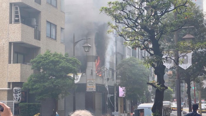 Smoke rises from a fire in the aftermath of an explosion in a bulding near Shimbashi Station, Tokyo, Japan July 3, 2023 in this still image obtained from video. Twitter/@_Clockwork_666/via REUTERS  THIS IMAGE HAS BEEN SUPPLIED BY A THIRD PARTY. MANDATORY CREDIT. NO RESALES. NO ARCHIVES.