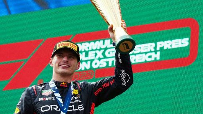 Winner Red Bull Racings Dutch driver Max Verstappen celebrates the podium after the Formula One Austrian Grand Prix at the Red Bull race track in Spielberg, Austria on July 2, 2023. (Photo by GEORG HOCHMUTH / APA / AFP) / Austria OUT