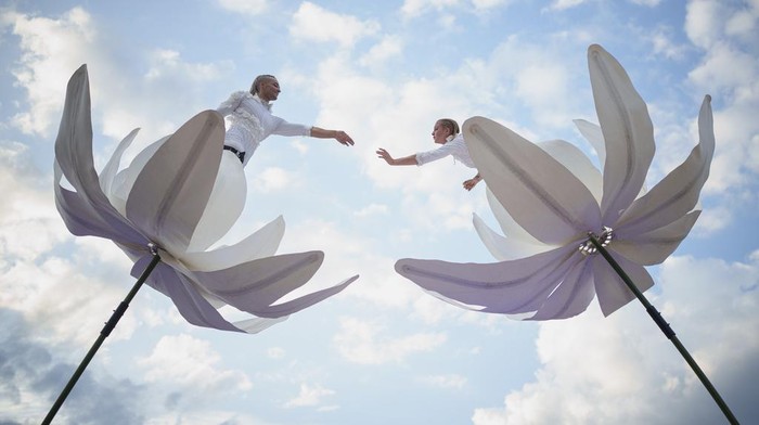 Artists of the French 20' Street Ballet perform during the B-FIT in the Street international festival in Bucharest, Romania, Sunday, July 2, 2023. The street theater festival took place over the weekend in the Romanian capital. (AP Photo/Vadim Ghirda)