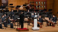 An android robot, EveR 6, is seen as it takes the conductors podium to lead a performance by South Koreas national orchestra, in Seoul, South Korea, June 30, 2023, in this handout picture. National Theater of Korea/Handout via REUTERS    THIS IMAGE HAS BEEN SUPPLIED BY A THIRD PARTY. MANDATORY CREDIT. NO RESALES. NO ARCHIVES