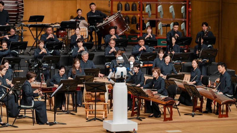 An android robot, EveR 6, is seen as it takes the conductor's podium to lead a performance by South Korea's national orchestra, in Seoul, South Korea, June 30, 2023, in this handout picture. National Theater of Korea/Handout via REUTERS    THIS IMAGE HAS BEEN SUPPLIED BY A THIRD PARTY. MANDATORY CREDIT. NO RESALES. NO ARCHIVES