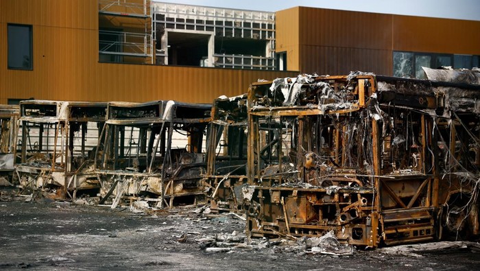 View of burnt buses at a RATP bus depot damaged during night clashes between protesters and police, following the death of Nahel, a 17-year-old teenager killed by a French police officer in Nanterre during a traffic stop, in Aubervilliers, near Paris, France, June 30, 2023. REUTERS/Sarah Meyssonnier