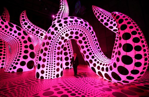 Visitors look at a part of Japanese artist Yayoi Kusama's installation 