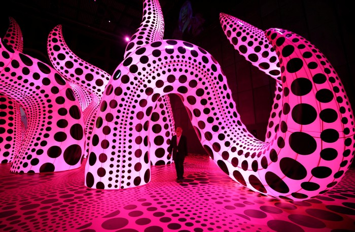 Visitors look at a part of Japanese artist Yayoi Kusama's installation 