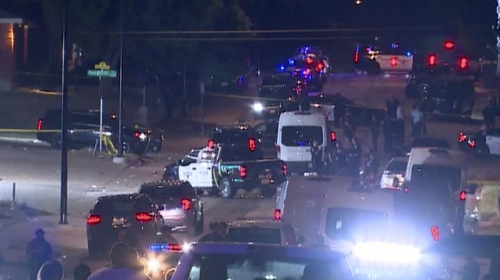 Police arrive on the scene of a deadly shooting late Monday, July 3, 2023 in Forth Worth, Texas.  Authorities say  gunfire erupted following a local festival in the Como neighborhood in the city's southwest.  (WFAA via AP)