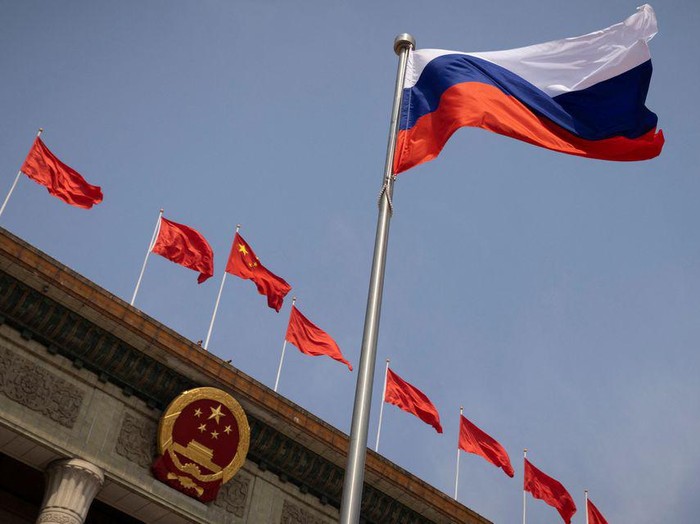 The Russian national flag flies in front of the Great Hall of the People before a welcoming ceremony for Russian Prime Minister Mikhail Mishustin in Beijing, China, May 24, 2023. REUTERS/Thomas Peter/Pool