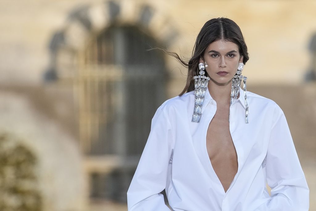 Kaia Gerber wears a creation for the Valentino Haute Couture Fall/winter 2023-2024 fashion collection presented in Chantilly, north of Paris, Wednesday, July 5, 2023. (AP Photo/Christophe Ena)