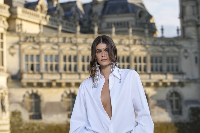 Kaia Gerber wears a creation for the Valentino Haute Couture Fall/winter 2023-2024 fashion collection presented in Chantilly, north of Paris, Wednesday, July 5, 2023. (AP Photo/Christophe Ena)