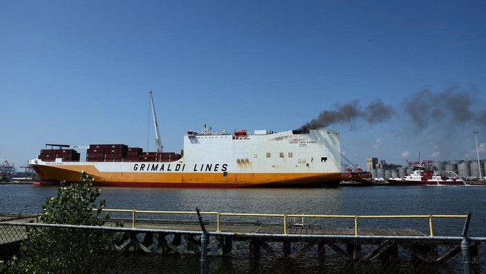 A New York City Fire Department (FDNY) fire boat sprays water on a cargo ship where two New Jersey firefighters were killed after they became trapped while battling a blaze, at Port Newark, New Jersey, U.S., July 6, 2023. REUTERS/Mike Segar       TPX IMAGES OF THE DAY