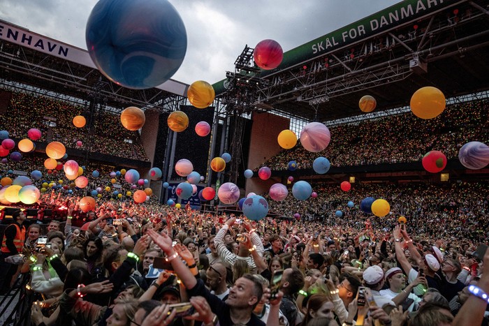 British singer Chris Martin of British band Coldplay performs at Parken Stadium in Copenhagen, Denmark, Wednesday July 5, 2023. The concert is part of the Music of the Spheres World Tour. (Mads Claus Rasmussen/Ritzau Scanpix via AP)