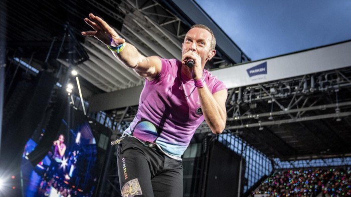 British singer Chris Martin of British band Coldplay performs at Parken Stadium in Copenhagen, Denmark, Wednesday July 5, 2023. The concert is part of the Music of the Spheres World Tour. (Mads Claus Rasmussen/Ritzau Scanpix via AP)