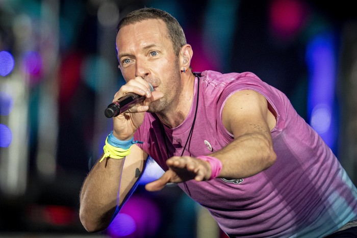 British singer Chris Martin of British band Coldplay performs at Parken Stadium in Copenhagen, Denmark, Wednesday July 5, 2023. The concert is part of the Music of the Spheres World Tour. (Mads Claus Rasmussen/Ritzau Scanpix via AP)
