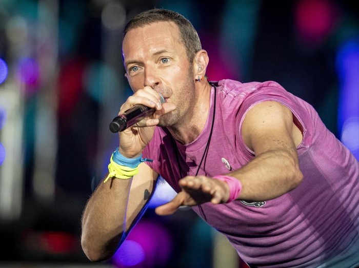 British singer Chris Martin of British band Coldplay performs at Parken Stadium in Copenhagen, Denmark, Wednesday July 5, 2023. The concert is part of the Music of the Spheres World Tour. (Mads Claus Rasmussen/Ritzau Scanpix via AP)