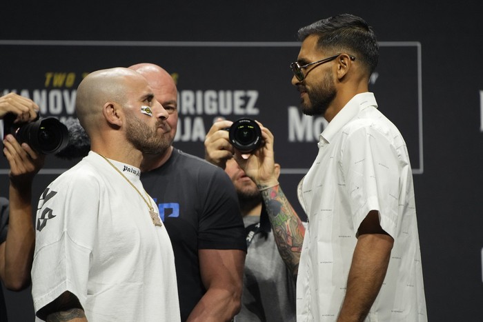 Alexander Volkanovski, left, and Yair Rodriguez pose during a news conference for the UFC 290 Mixed Martial arts event Thursday, July 6, 2023, in Las Vegas. The two are scheduled to fight in a featherweight championship bout Saturday in Las Vegas. (AP Photo/John Locher)
