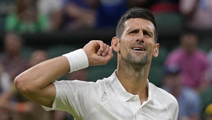 Serbias Novak Djokovic celebrates after beating Switzerlands Stan Wawrinka in a mens singles match on day five of the Wimbledon tennis championships in London, Friday, July 7, 2023. (AP Photo/Alberto Pezzali)