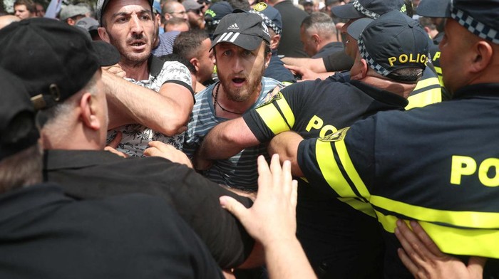 Anti-LGBTQ protesters scuffle with police as they try to break into the site of Tbilisi Pride Fest, in Tbilisi, Georgia July 8, 2023. REUTERS/Irakli Gedenidze     TPX IMAGES OF THE DAY