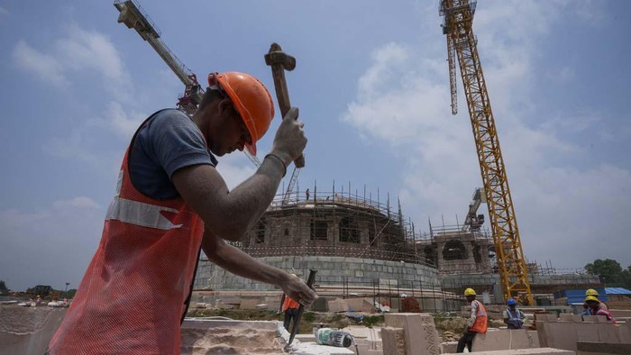 Workers are engaged in the construction of a temple of Hindu god Ram, at the site of demolished Babri Masjid mosque in Ayodhya, India, Sunday, July 9, 2023. The 16th century mosque was destroyed by Hindu radicals in December 1992, sparking massive Hindu-Muslim violence that left some 2,000 people dead. The Supreme Court's verdict allowed a temple to be built in place of the demolished mosque. (AP Photo/Rajesh Kumar Singh)