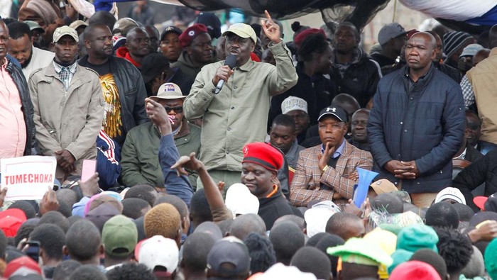 Supporters of Kenya's opposition leader Raila Odinga of the Azimio La Umoja (Declaration of Unity) One Kenya Alliance, run after riot police officers lobbed tear gas to disperse them during an anti-government protest dubbed 