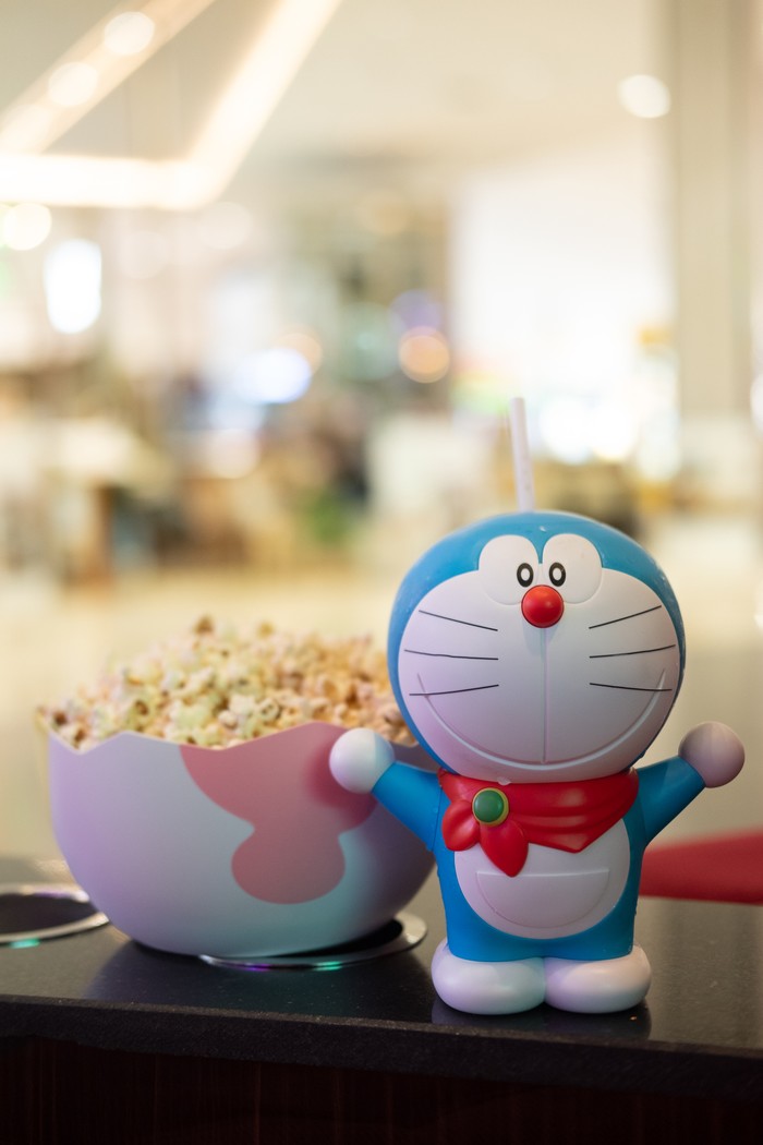 Bangkok, Thailand - January 3, 2020 : Cute toy of Doraemon set of bucket popcorn and soft drink to promote the movie : Nobitas New Dinosaur from Advertising Major Cineplex Group Plc.