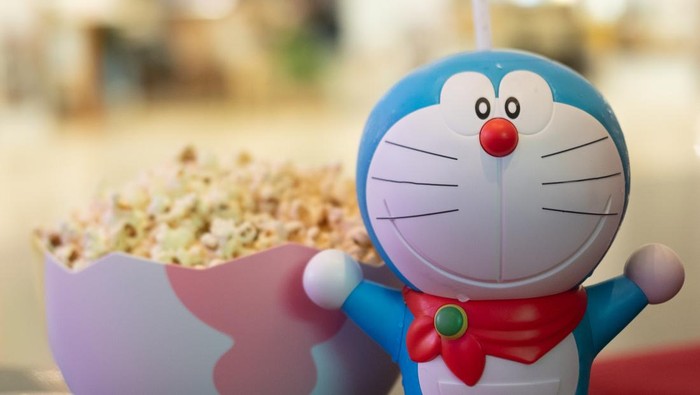Bangkok, Thailand - January 3, 2020 : Cute toy of Doraemon set of bucket popcorn and soft drink to promote the movie : Nobitas New Dinosaur from Advertising Major Cineplex Group Plc.