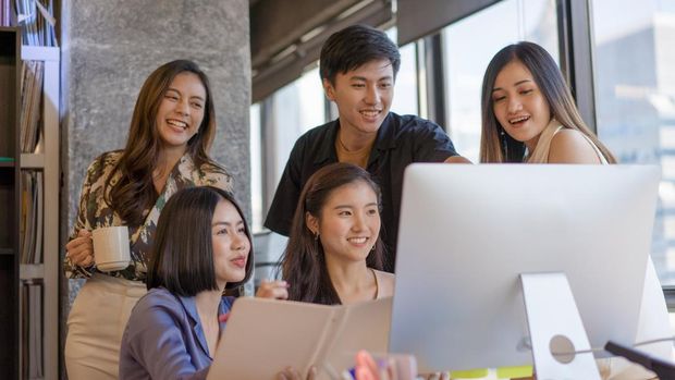 Portrait young asian creative business person working success project with team Business people weare casual suit outfit working happy action in modern Coworking space
