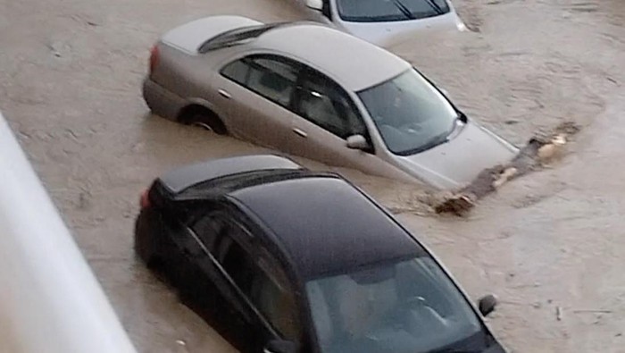 A view of cars submerged in floodwater on a street in Nebug, Russia, July 12, 2023, in this still image taken from a social media video. Larisa Zakirova/via REUTERS  THIS IMAGE HAS BEEN SUPPLIED BY A THIRD PARTY. MANDATORY CREDIT. NO RESALES. NO ARCHIVES.