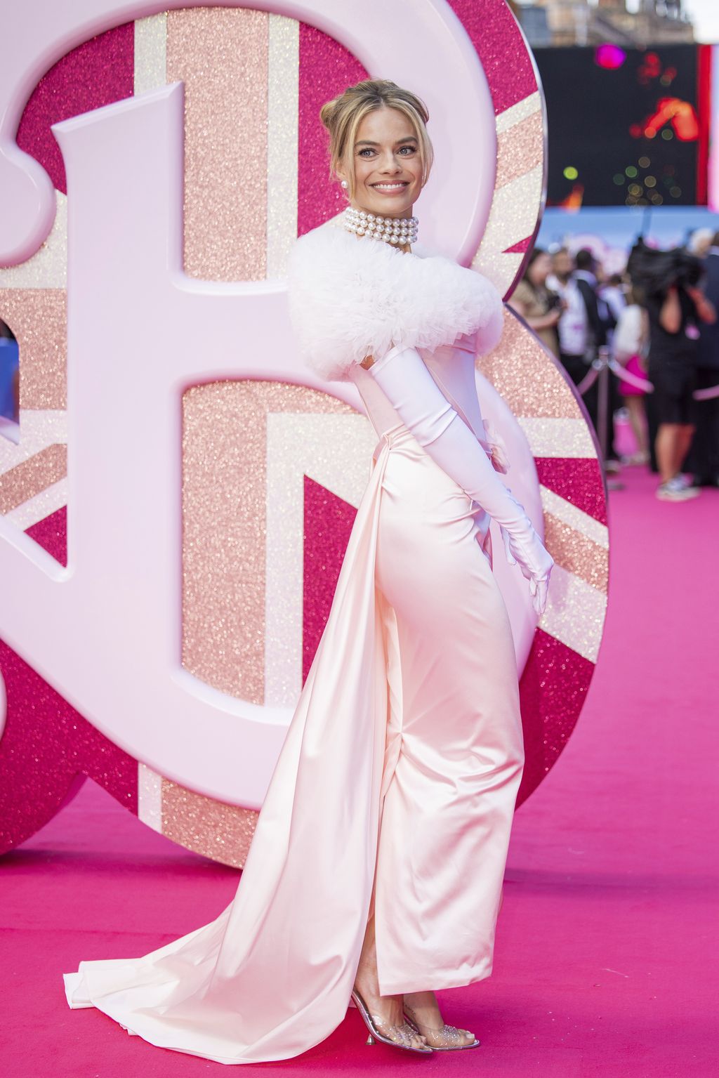 Margot Robbie poses for photographers upon arrival at the premiere of the film 'Barbie' on Wednesday, July 12, 2023, in London. (Vianney Le Caer/Invision/AP)