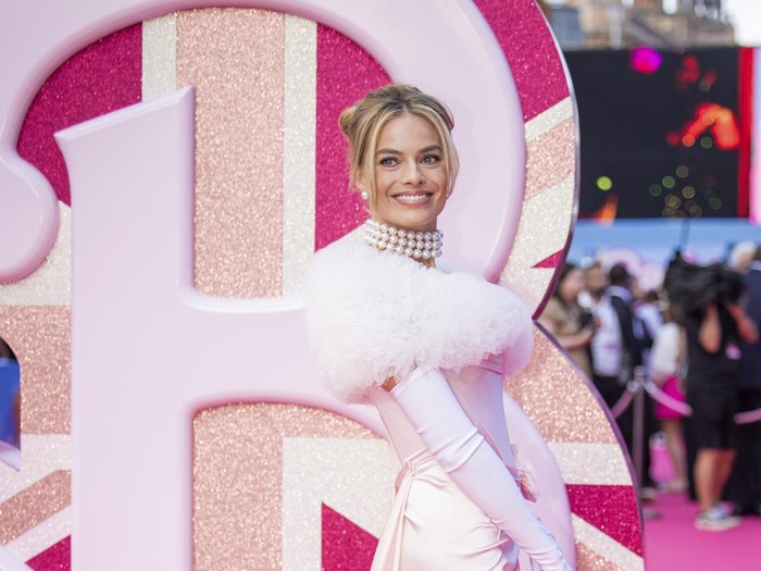 Margot Robbie poses for photographers upon arrival at the premiere of the film Barbie on Wednesday, July 12, 2023, in London. (Vianney Le Caer/Invision/AP)