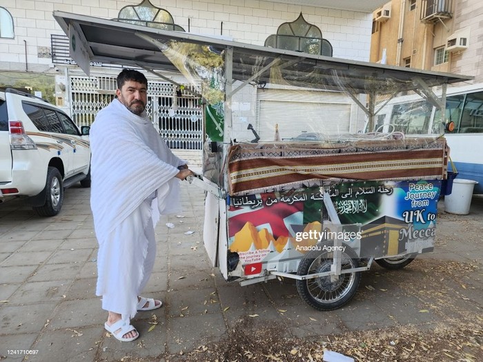 MECCA, SAUDI ARABIA - JULY 03: 53-year-old Iraqi electrical engineer Adam Mohammed visits the holy land to fulfill the Hajj pilgrimage in Mecca, Saudi Arabia on July 03, 2022, after he has walked with his three-wheeled mobile vehicle from the UK to Saudi Arabia in 11 months, crossing 11 countries on the way. Adam Muhammed, who has been living in the UK for about 25 years, set out to go to the holy land after a dream he had in August last year, as he calls his walking experience peace journey. (Photo by Ashraf Amra/Anadolu Agency via Getty Images)